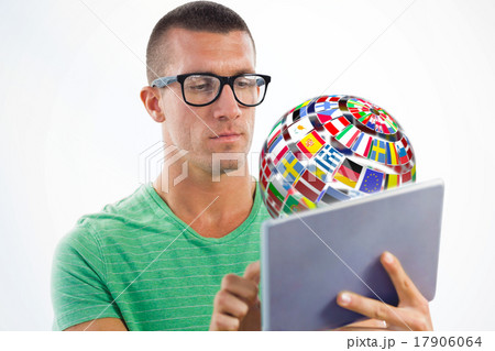 Composite image of man wearing glasses while using tablet comput 17906064