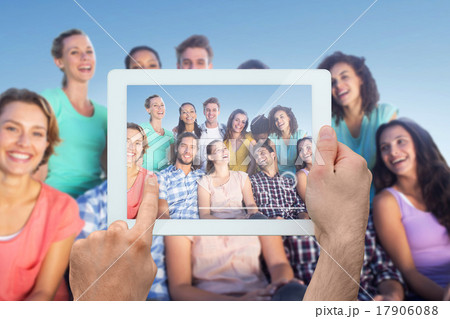 Composite image of hand holding tablet pc 17906088