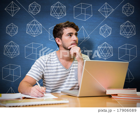 Composite image of student studying in the library with laptop 17906089