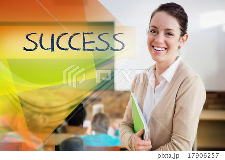 Success against pretty teacher smiling at camera at back of clas Success against pretty teacher smiling at camera at back of clas 17906257