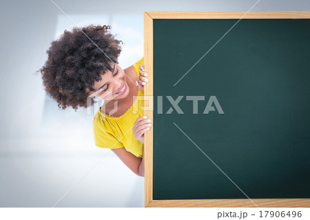 Composite image of woman showing card 17906496