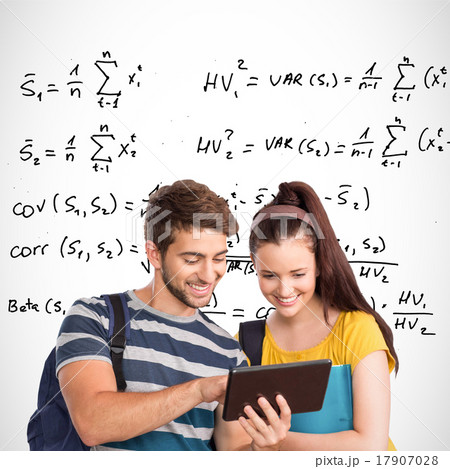 Composite image of happy students using tablet pc 17907028