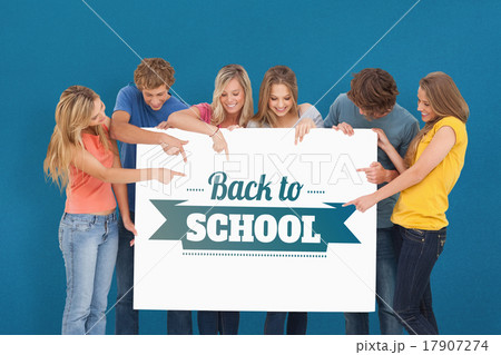 Composite image of a group holding a blank sheet and pointing to 17907274