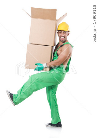 Man in green coveralls with boxes Man in green coveralls with boxes 17909118