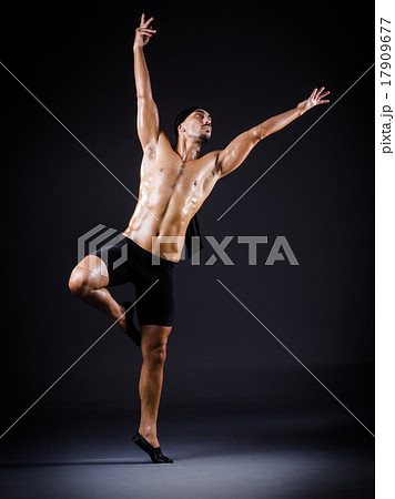 Dancer dancing in the dark studio 17909677