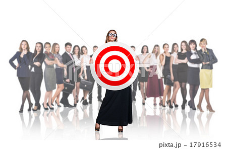 Surprised business woman holding big target Surprised business woman holding big target 17916534