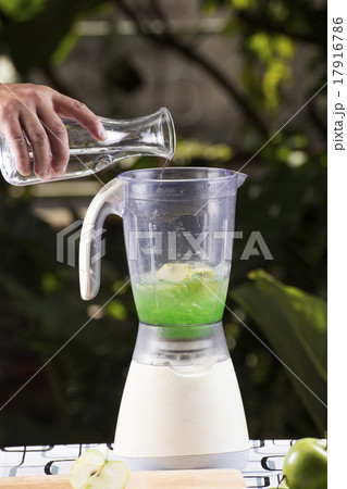 Chef pouring water to the Blender Chef pouring water to the Blender 17916786