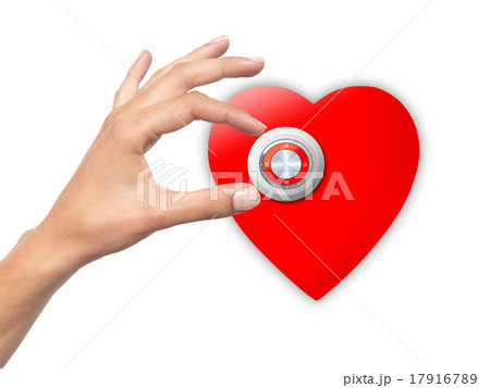Woman hand opens locked heart 17916789