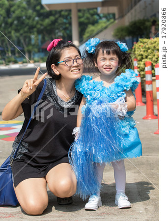 mother and young kid daughter wearing cheer leader dressing in k mother and young kid daughter wearing cheer leader dressing in k 17920866