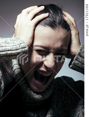 young pretty woman in trouble, screaming in grief young pretty woman in trouble, screaming in grief 17921388