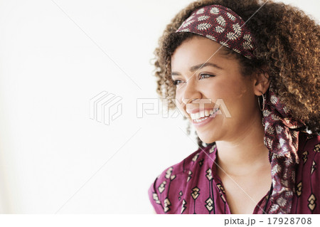 Portrait of smiling woman with curly hair 17928708