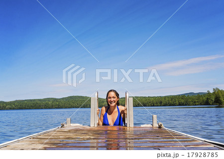 Young woman coming out of water on jetty 17928785
