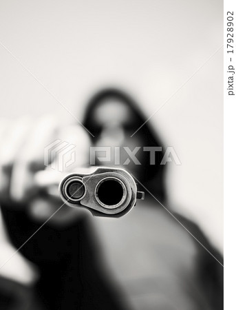 Man with handgun pointing towards camera 17928902