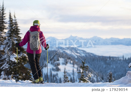 Female skier against mountains 17929054