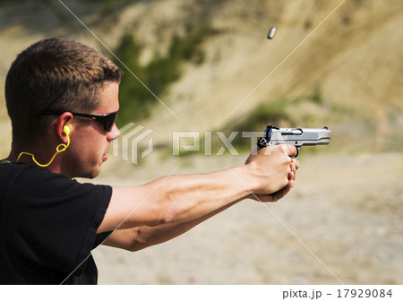 Man shooting handgun 17929084