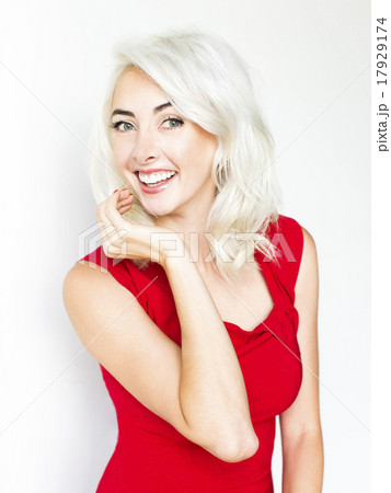 Studio shot of woman wearing red dress 17929174