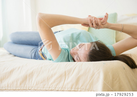 Woman relaxing in bed 17929253