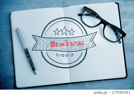 Business against overhead of open notebook with pen and glasses Business against overhead of open notebook with pen and glasses 17930391