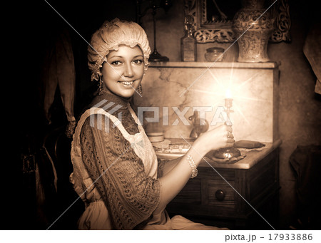 woman in old cap with candlestick woman in old cap with candlestick 17933886