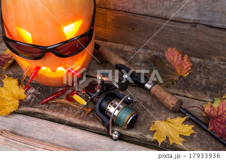 halloween pumpkin in eyeglass with fishing tackles 17933936