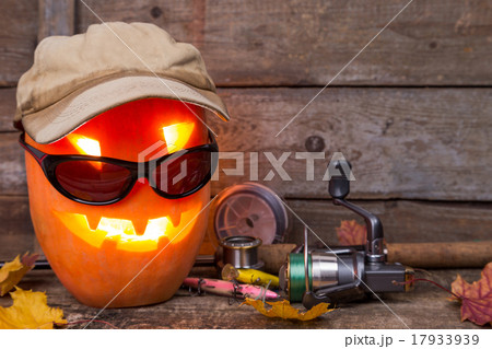 halloween pumpkin in hat with fishing tackles halloween pumpkin in hat with fishing tackles 17933939