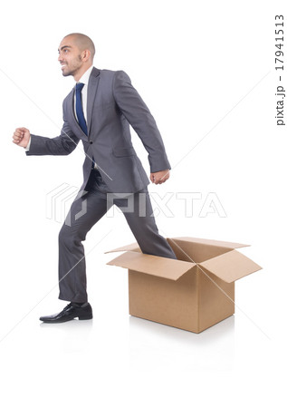 Businessman with box isolated on the white Businessman with box isolated on the white 17941513