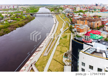 Semi-flooded embankment on Tura rive.Tyumen.Russia 17947499