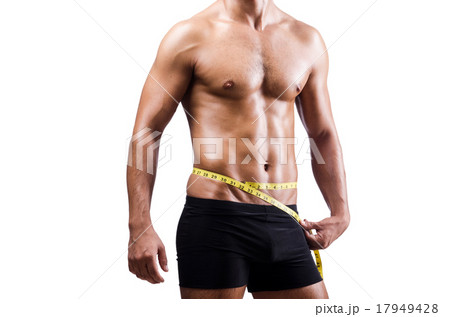Muscular man measuring his muscles Muscular man measuring his muscles 17949428