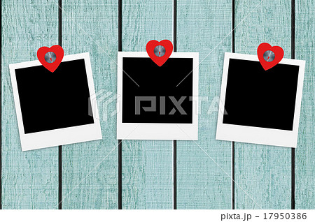 Blank old photos on clips on color wood background Blank old photos on clips on color wood background 17950386