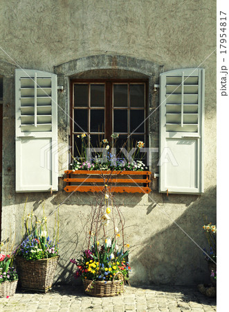 rustic window with old shutters and flower pots  17954817