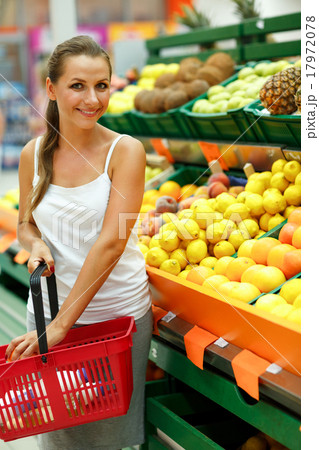 Young woman shopping in a supermarket in the department of fruit 17972078