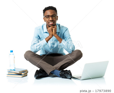 Happy african american college student with laptop Happy african american college student with laptop 17973890