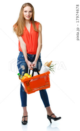 Woman holding a basket full of healthy food Woman holding a basket full of healthy food 17974678