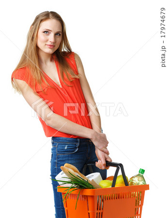 Woman holding a basket full of healthy food 17974679