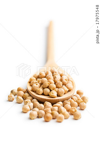 uncooked chickpeas in wooden spoon uncooked chickpeas in wooden spoon 17975548