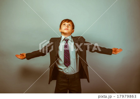 Teen boy businessman spread his arms look up 17979863