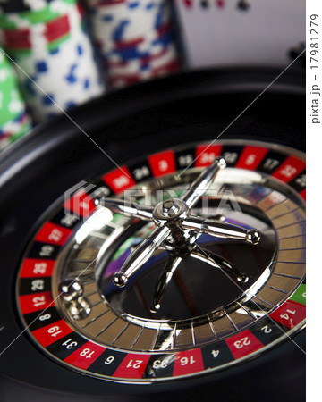 Poker Chips on a gaming with casino roulette 17981279