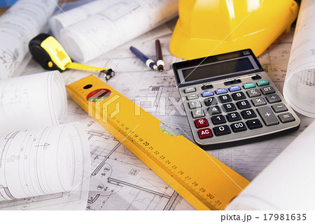 Hard hat with blueprints and rulers 17981635