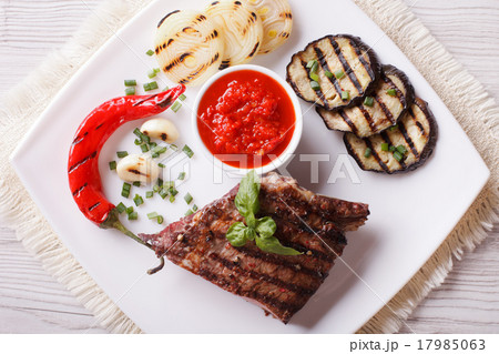 beefsteak, grilled vegetables and sauce top view 17985063