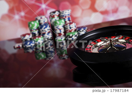 Poker Chips on a gaming with casino roulette Poker Chips on a gaming with casino roulette 17987184