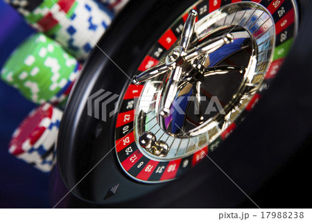 Poker Chips on a gaming with casino roulette Poker Chips on a gaming with casino roulette 17988238