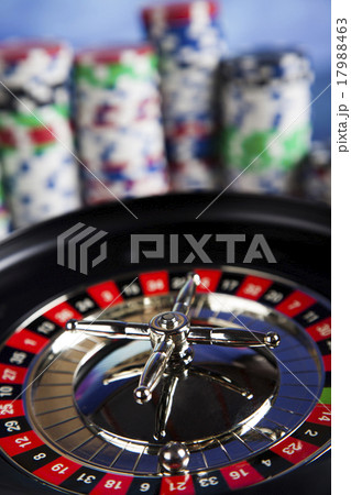 Poker Chips on a gaming with casino roulette Poker Chips on a gaming with casino roulette 17988463