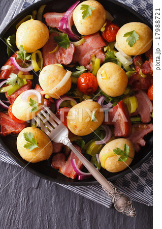 Fried bacon with potatoes close-up top view 17988721