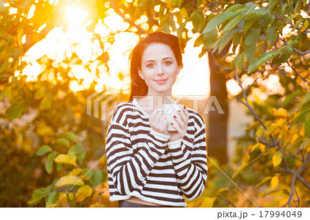Woman with cup of tea or coffee 17994049