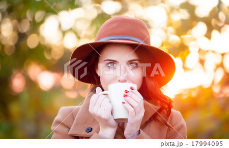 Woman with cup of tea or coffee 17994095