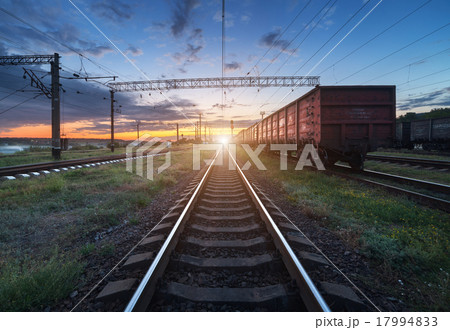 Cargo train platform at sunset. Railroad. Railway 17994833