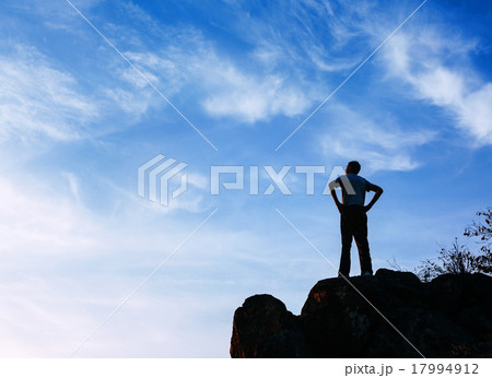 Silhouette of a man at the sunset on the mountain Silhouette of a man at the sunset on the mountain 17994912