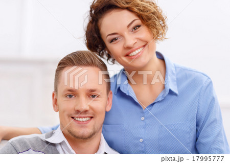 Pleasant couple sitting in the armchair  17995777