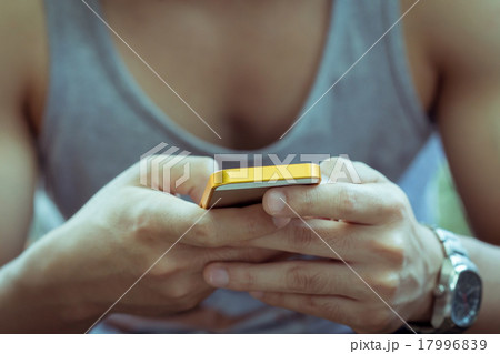 lifestyle young man using a mobile phone lifestyle young man using a mobile phone 17996839
