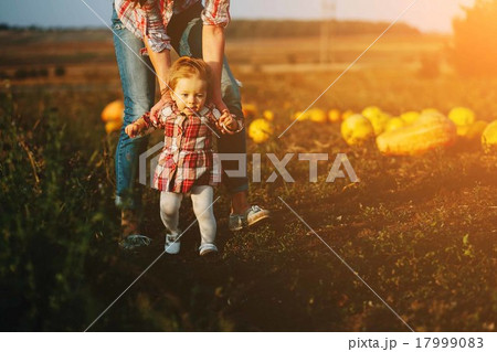 mother teaching her daughter to walk mother teaching her daughter to walk 17999083